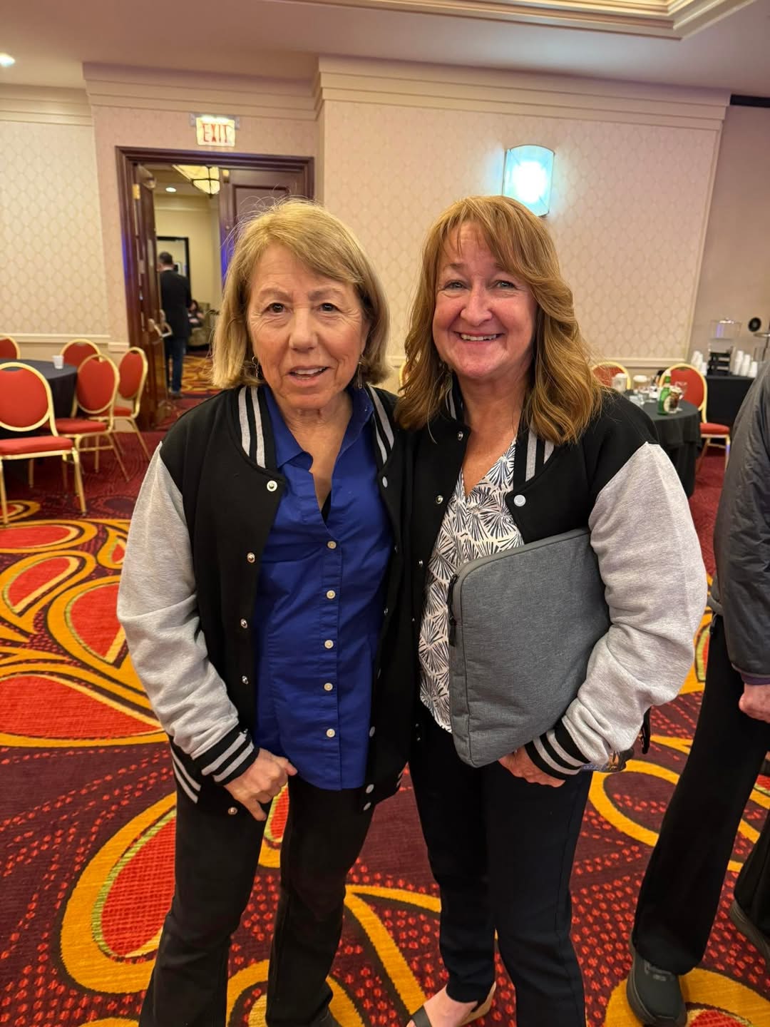 two woman smiling